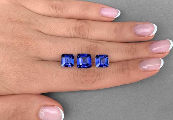 Emerald cut tanzanite set 11.77 ct