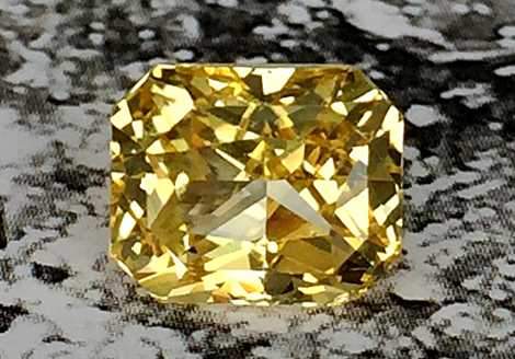 Bright radiant cut unheated yellow sapphire 3.12 ct