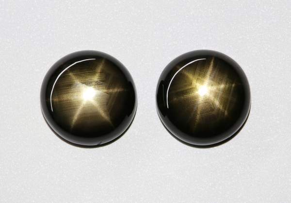 Pair of round shaped black star sapphires 9.19 ct